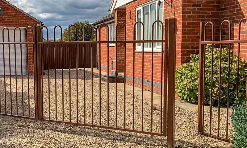 Steel garden railings and matching gate in brown